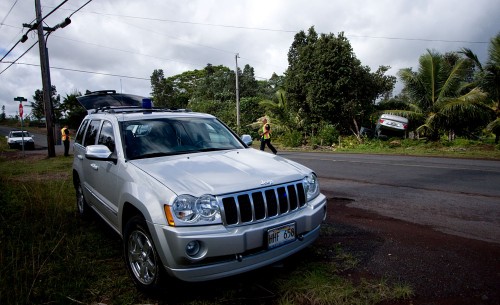 20081217_overturned-car-with-officers Hawaii County police and a fire units responded to a single vehicle accident on Kaloli Drive near 15th Avenue. (Photo by Baron Sekiya/Hawaii247.com)