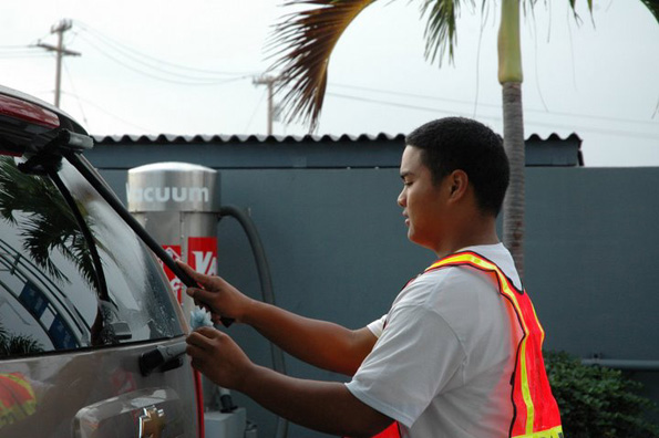 sowhcarwash A volunteer puts the shine on a vehicle's window during the car wash. (Photo by KC Strand/courtesy of Special Olympics West Hawaii)