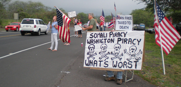 taxteaparty2 More than 100 people turned out Wednesday in Kona for the Tax Day Tea Party. (Hawaii247.com photo by Karin Stanton)