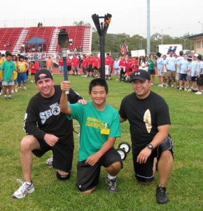 torch_large Officer Jason Grouns, Special Olympics Athlete Shawn Ono, and Officer Joseph Rocha.