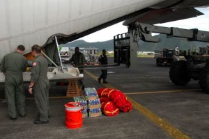 PAGO, PAGO, American Samoa - A Honolulu-based U.S. Coast Guard C-130 long-range search plane from Air Station Barbers Point arrives in Pago Pago, Wednesday, Sept. 30, 2009, to deliver aid and assess damage after a powerful earthquake and tsunami hit the U.S. territory. (U.S. Coast Guard photo/Petty Officer 3rd Class Luke Clayton)