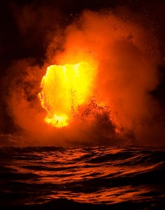 The ocean boils from lava pouring off the Waikupanaha bench west of Kalapana.