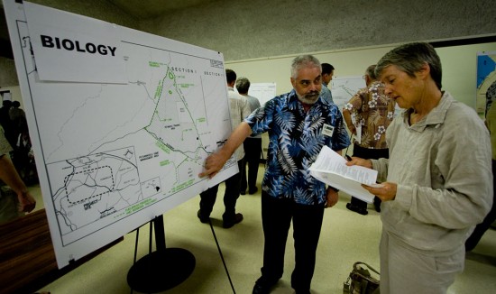 Consultant Reggie David, left, talks to Cory Harden, of the Sierra Club, about the biological systems in the Saddle Road project area.