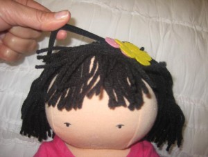 recalls-potterybarnkids-dolls6 Remove the headband of the Audrey doll to remove the hazard.