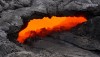 This skylight provided a clear view of the lava stream inside the lava tube on today's overflight, and a swiftly moving current could easily be seen. Photo courtesy of USGS/HVO
