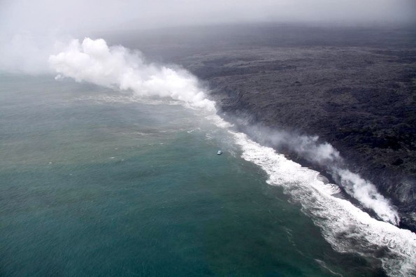 Lava has continued to enter the ocean at West Kailiili, with numerous entry points scattered along a broad section of the coast. The small boat in the center of the image provides a rough sense of scale. Photo courtesy of USGS/HVO
