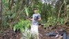 Project Coordinator Mike Donoho holds plants ready to go in the ground.