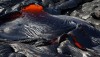 A few hundred meters (yards) up from the lava flow front, pahoehoe breakouts of a more fluid appearance were abundant. USGS Photo by David Dow