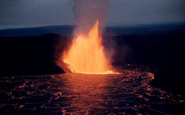 A lava fountain from the base of Pu`u Pua`i cone feeds a lava lake in Kilauea Iki Crater. Photo taken on December 5, 1959. Photo courtesy of USGS/HVO