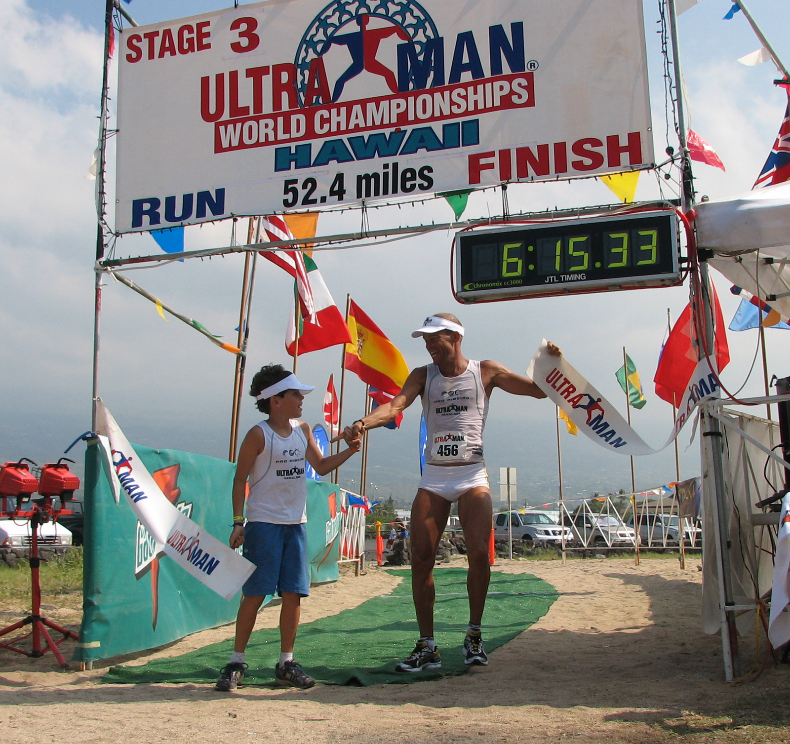 ribeiroson Alexandre Ribeiro, of Rio de Janerio, and son Kaillani enjoy their moment at the finish line of the Ultraman Sunday, Nov. 30, 2008 at Old Airport Beach Park in Kailua-Kona.