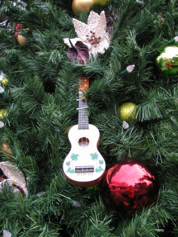 xmastreedecoration The holiday tree at Emma's Square include ukulele, balls and floral decorations.
