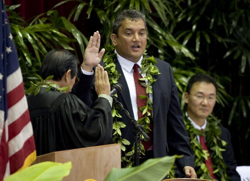 County of Hawaii Inaugural Ceremonies at Afook-Chinen Civic Audi Billy Kenoi, center, recites the oath of office from Judge Ronald Ibarra, left, as Council Chair J. Yoshimoto watches during inaugural ceremonies at Afook-Chinen Civic Auditorium.