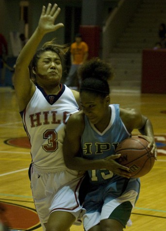 20090102_kirihara-gravely Hawaii Pacific's Paris Gravely (15) right, drives past UH-Hilo Vulcan Kayce Kirihara (3) during action Friday night in Hilo.