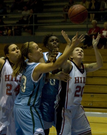 20090102_rebound Sheila Azevedo (24), Angel Spence (33), Genesis Lewis and Amanda Adams (20) battle under the UH-Hilo basket for a rebound during women's basketball at Afook-Chinen Civic Auditorium.