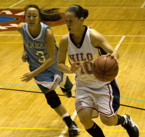 20090102_uhh-ashley-kualii UH-Hilo Vulcan Ashley Kualii (10) is up against Hawaii Pacific University's Mackenna Karasawa (3) during college basketball action in Hilo.