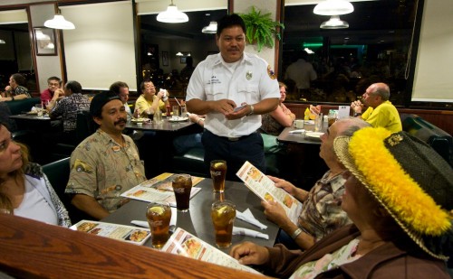 20090222_gantry-andrade Fire Inspector Gantry Andrade waits on a table at Denny's for the Project Compassion fundraiser for a fellow firefighter.