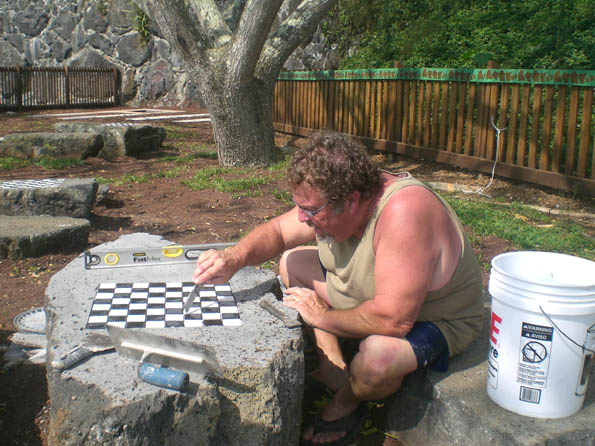 higashiharachess1 The chass tables are just about ready for playing chess. The rest of the playgound needs volunteers. (Photo courtesy of Cliff Kopp)