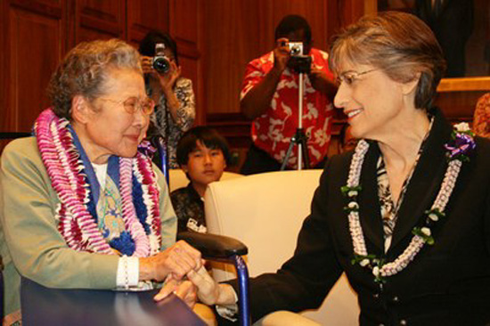 kaidelingle Gov. Linda Lingle presents Terry Kaide with the signed bill. (Photo courtesy of the Governor's Office)