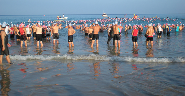 703swimstart Nearly 1,200 athletes prepare for the start cannon Saturday at Hapuna Beach. All the swimmers made the cut off. (Hawaii247.com photo by Karin Stanton)