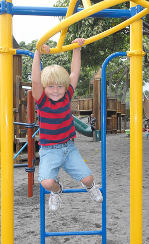 Higashihara Park Reopening Brett Berges, 5, is one of the first to try out the new equipment Tuesday after Kamakana Playground reopened. (Hawaii247.com photo special by Brad Ballesteros)