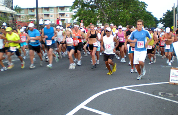 2marathon2009 Runners take off at the start of the Kona Marathon on Sunday, June 28 on Alii Drive outside the Outrigger Keauhou Beach Hotel. (Hawaii247.com photo by Karin Stanton)