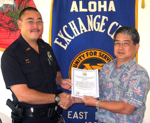kelii_large Aloha Exchange Club President Dale Tokuuke, right, presents an 'Officer of the Month' award to Officer Kayne Kelii.