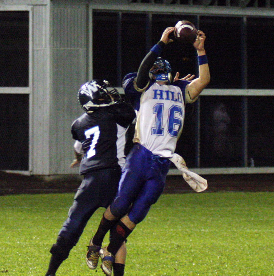 HiloGhost A spooky apparition appeared at Friday night's BIIF football game, just in time for Halloween. Also in the photo, Hilo's Ryan Arizo grabs a 34-yard pass.(Hawaii 24/7 photo special by Tim Wright)