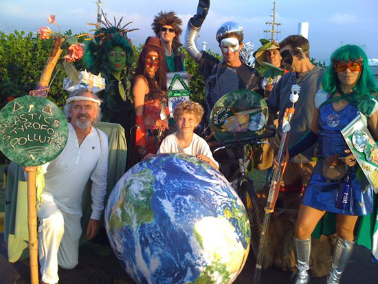 GreenPowerHeroesParade Among the Green Power Heroes who swooped in to deliver their ecology message were Sir Zero Wasted, Back to the Green, Crimson Tide, Buddy Biomass, Mercury Man, Anti-GMO Man, Mighty Mene Man, Green Power Girl, and Ezra. (Hawaii 24/7 photo courtesy of Andrea Dean)