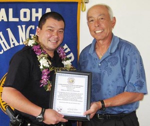 oom-matsuda-estrella Aloha Exchange Club representative Joey Estrella presents an 'Officer of the Month' award to Officer Shawn Matsuda