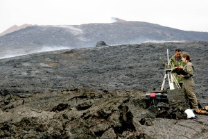 20110610_cheliker_0095_L HVO geologist and helicopter pilot repair a mobile Webcam on Kupaianaha to continue monitoring the east flank of Pu`u `Ō `ō. Photo courtesy of USGS/HVO