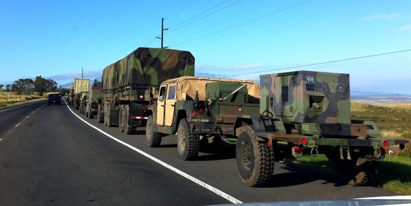 20110614_military-convoy-hwy190 A military convoy pulls over onto the shoulder of Mamalahoa Highway (Hwy 190) to let traffic pass after exiting Saddle Road as it heads south to Waikolola Road. You probably would not want to get stuck behind this convoy on Saddle Road. Photography by Baron Sekiya | Hawaii 24/7