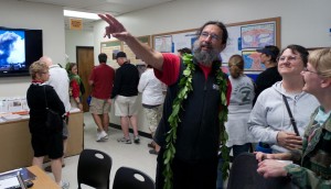 Jim Kauahikaua During the Hawaiian Volcano Observatoryâs centennial open house, HVO Scientist-in-Charge Jim Kauahikaua points to data displays as he explains how Hawaiian volcanoes and earthquakes are monitored to some of the more than 1,400 people who attended the January 21 event. USGS photo by Ben Gaddis.