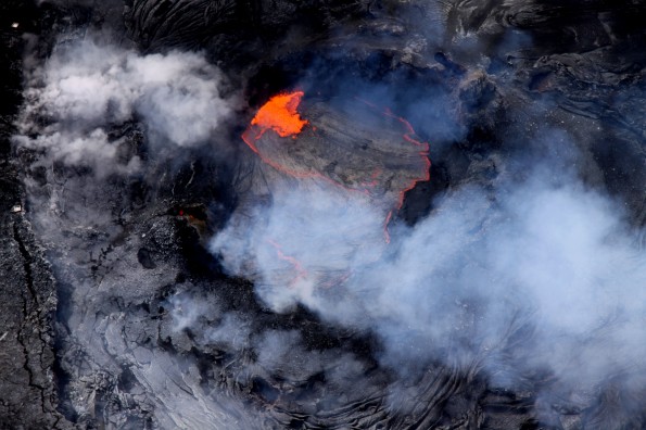 20120426_halemaumau A lava pond has been active in a collapse pit in the eastern portion of Pu‘u ‘O‘o crater for over a month now, with continuous roiling and spattering. For scale, two spatter collection trays - each slightly larger than a lunch tray - can be seen on the crater's rim at the left edge of the image. Photo courtesy of USGS/HVO