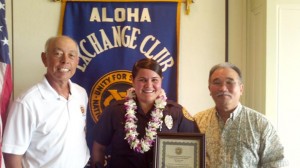 OfficeOfTheMonthchere-lyons Hilo Exchange Club member Joey Estrella and club president Jay Kimura present an 'Officer of the Month" plaque to Chere Lyons.