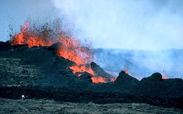These vents on Mauna Loa’s northeast rift zone were the primary source of lava during the 1984 eruption. Note person in lower left for scale. Photo was taken on March 26, 1984. Photo courtesy of USGS/HVO