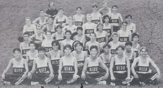 Waiakea High School cross country team, with Peter Sur to the lower left and Coach Wayne Joseph to the upper left.