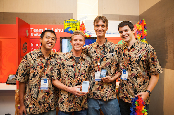 UH Hilo Team Poli`ahu (L-R): Wallace Hamada, Mike Purvis, Ryder Donahue, and Kayton Summers pose in front of their booth at the 11th worldwide Imagine Cup in St. Petersburg, Russia. (Photo courtesy of UH Hilo)