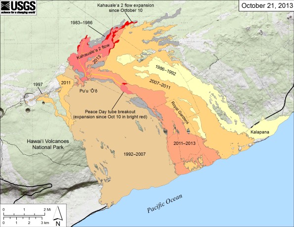 Small-scale map showing Kīlauea’s east rift zone flow field as of October 21, 2013. The Peace Day flow (light orange), remains active…barely. One small breakout continues to leak from the tube on the upper flow field. The tube below this point has likely been abandoned, and no lava is reaching the coastal plain or entering the ocean. Near Puʻu ʻŌʻō, the Kahaualeʻa 2 flow is still active northeast of Puʻu ʻŌʻō. The Kahaualeʻa 2 flow and the breakout from the Peace Day tube as of October 10 are shown in pink, while expansion of both flows as of October 21 are shown in red. Older lava flows are labeled with the years in which they were active: episodes 1–48b flows (1983–1986) are shown in gray; episodes 48c–49 flows (1986–1992) are pale yellow; episodes 50–55 flows (1992–2007) are tan; and episodes 58–60 flows (2007–2011) are pale orange. The active lava tubes are shown with yellow lines. Map courtesy of USGS/HVO