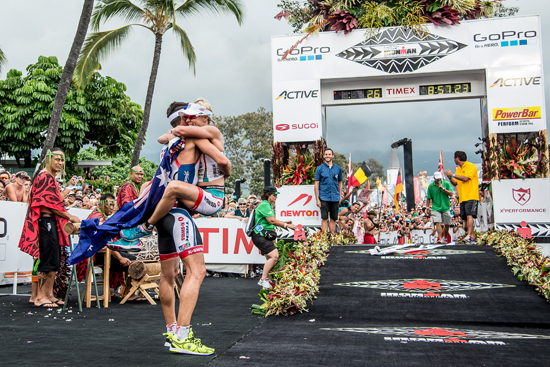 2013 world champion Mirinda Carfrae is greeted at the finish line by fiance Tim O'Donnell, who was the top U.S. finisher. (Photo courtesy of Nils Nilsen | Ironman)