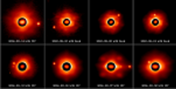 Sylvia and its moons as seen from the 8-10m class telescopes with adaptive optics. The dark circle shows the irregular shape of the asteroid. The small moons can be seen at various positions on these images. More than 66 observations were collected, some were recorded by our team others were extracted from Keck Observatory, Gemini and VLT archive data. (Photo courtesy of Franck Marchis)