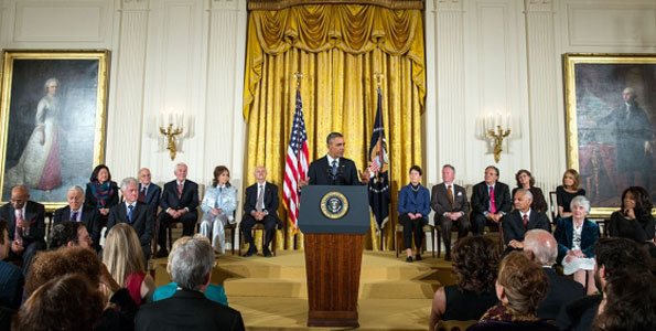 President Barack Obama delivers remarks and awards the 2013 Presidential Medal of Freedom to honorees during a ceremony in the East Room of the White House, Nov. 20, 2013. Honorees are: Ernie Banks, Ben Bradlee, former President Bill Clinton, Daniel Inouye (posthumous), Daniel Kahneman, Richard Lugar, Loretta Lynn, Mario Molina, Sally Ride (posthumous), Bayard Rustin (posthumous), Arturo Sandoval, Dean Smith, Gloria Steinem, Cordy Tindell "C.T." Vivian, Patricia Wald, and Oprah Winfrey. (Photo courtesy of Pete Souza | White House)