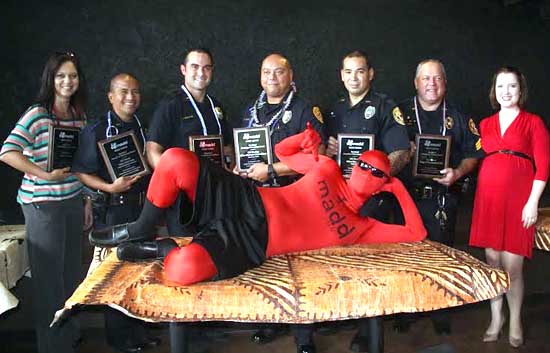 From left: Cynthia Honma of Hilo – Community Service Award; Officer Keith Nacis – Traffic Enforcement Unit I; Officer Nicholas McDaniel – Kona Patrol; Officer Christopher Kapua-Allison – Top Cop: South Hilo Patrol; Officer Shea Nactor – Puna Patrol; Sgt. Christopher Gali – Community Service Award; Executive Director Abigail Nickell – MADD Hawaii. (Photo courtesy of MADD Hawaii)
