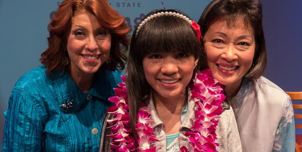 From left: PBS president / CEO Leslie Wilcox; Christianne Abella, 2014 aio Hawaii State Spelling Bee Champion; Susan Eichor, aio President and Chief Operating Officer. (Photo courtesy of PBS Hawaii)
