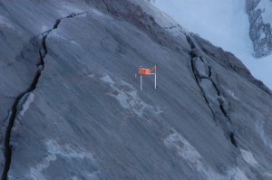 Mid-January 2005 photograph of station CDAN GPS spider on extruding spine 4. Legs of differing lengths permitted level deployment on 32° slope. Legs are embedded several centimeters into soft gouge that mantles spine. USGS photo by J.S. Pallister, January 14, 2005.