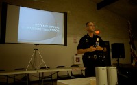 Officer Thomas Shopay III gives an 'active shooter' presentation at Aunty Sally Kaleohano's Luau Hale in Hilo during a police community meeting Monday (June 23). Photography by Baron Sekiya | Hawaii 24/7