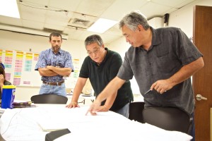 Hawaii Electric Light Company President Jay Ignacio, right, works with fellow HELCO staff on coordinating power restoration efforts on August 13, 2014. Photo courtesy of HECO.
