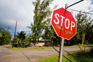 Utility lines still down at the bottom of Makuu Drive and Ala Heiau Road in Hawaiian Paradise Park. This is one of the areas where crews are still working to restore power and services. Photography by Baron Sekiya | Hawaii 24/7