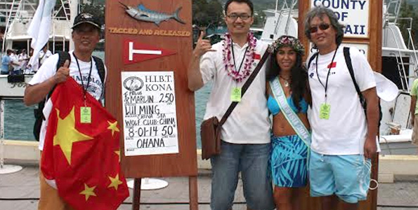 Miss Billfish Nicolette Noelani Palacol congratulates 55th Annual Hawaiian International Billfish Tournament winners. (Photo courtesy of HIBT)