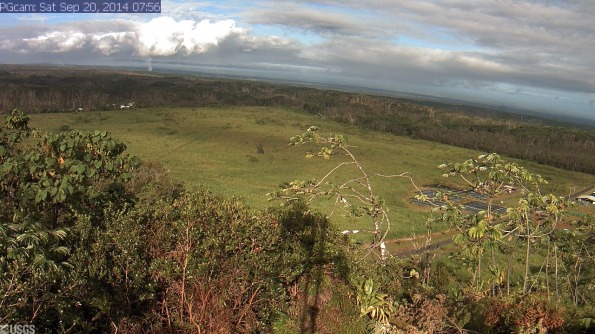 Webcam image taken at 7:56 a.m. Saturday (Sep 20) of Kilauea's June 27th Flow and the Lower East Rift Zone. The camera is positioned near Kapoho looking Northwest. From left to right on the horizon, one can see Puʻu ʻŌʻō vent near the left edge of the image, the gas plume from Halemaʻumaʻu crater (when clear enough), with Mauna Loa and Mauna Kea farther to the right. The advancing front of the June 27th lava flow is burning vegetation and sending smoke aloft in the left center of the image. Photo courtesy of USGS/HVO