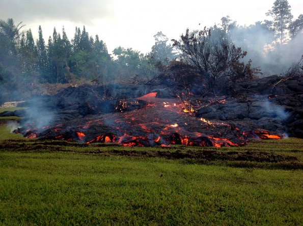 A breakout occurs from an inflated lobe of the June 27th lava flow on Sunday morning, November 2, 2014. Scattered breakouts like this, which took place about 200 meters (218 yards) upslope of the stalled leading edge, have been common over the past few days and are filling in low points behind the flow front. Photo courtesy of USGS/HVO